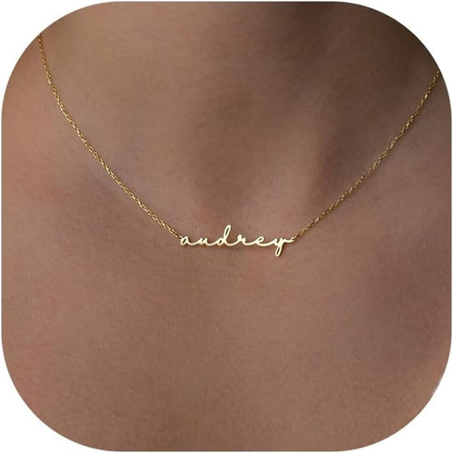 Gold name necklace with 'audrey' on a fine cable chain
